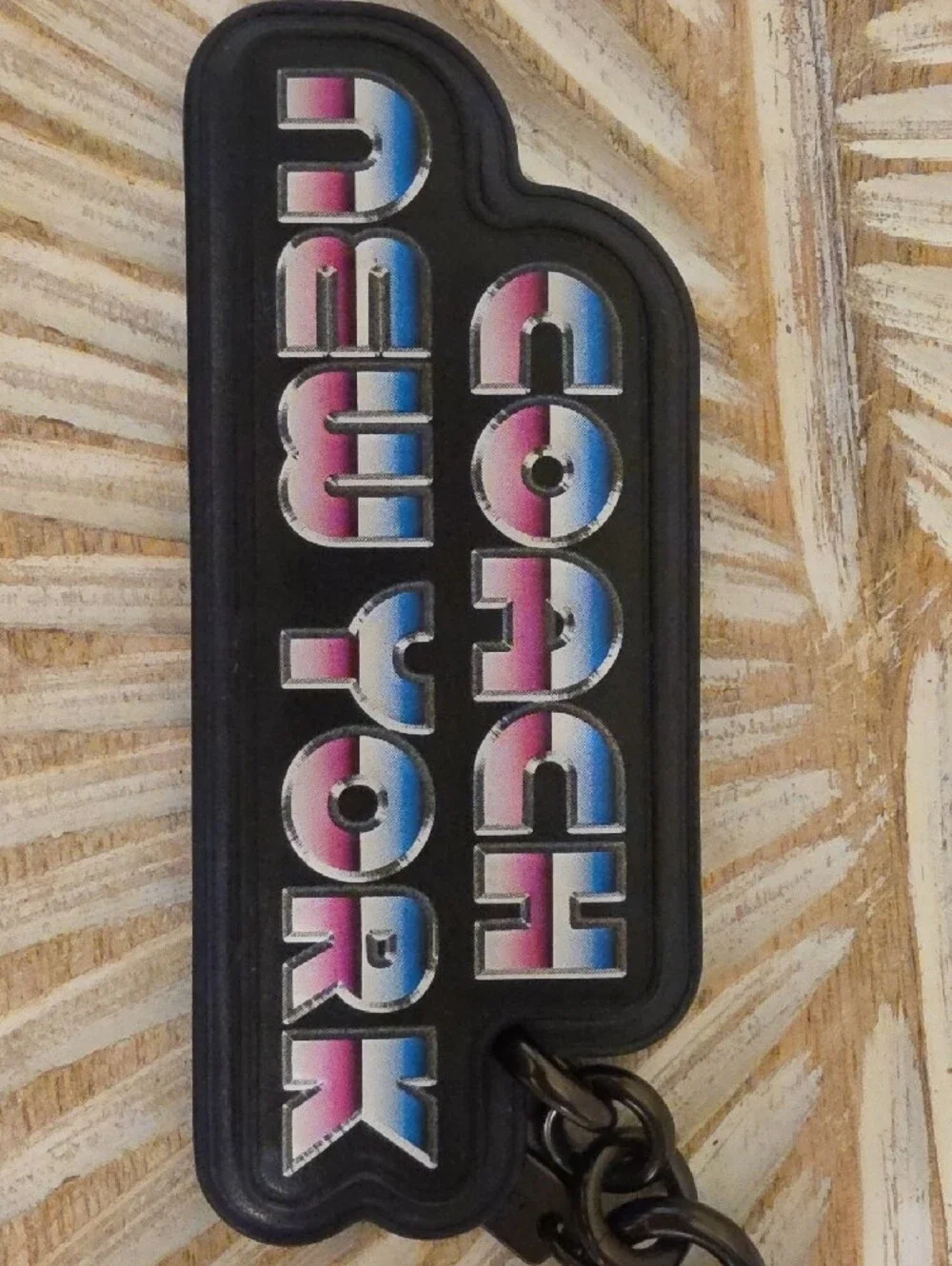 Coach Black Logo Keychain with Blue-Pink Gradient Lettering